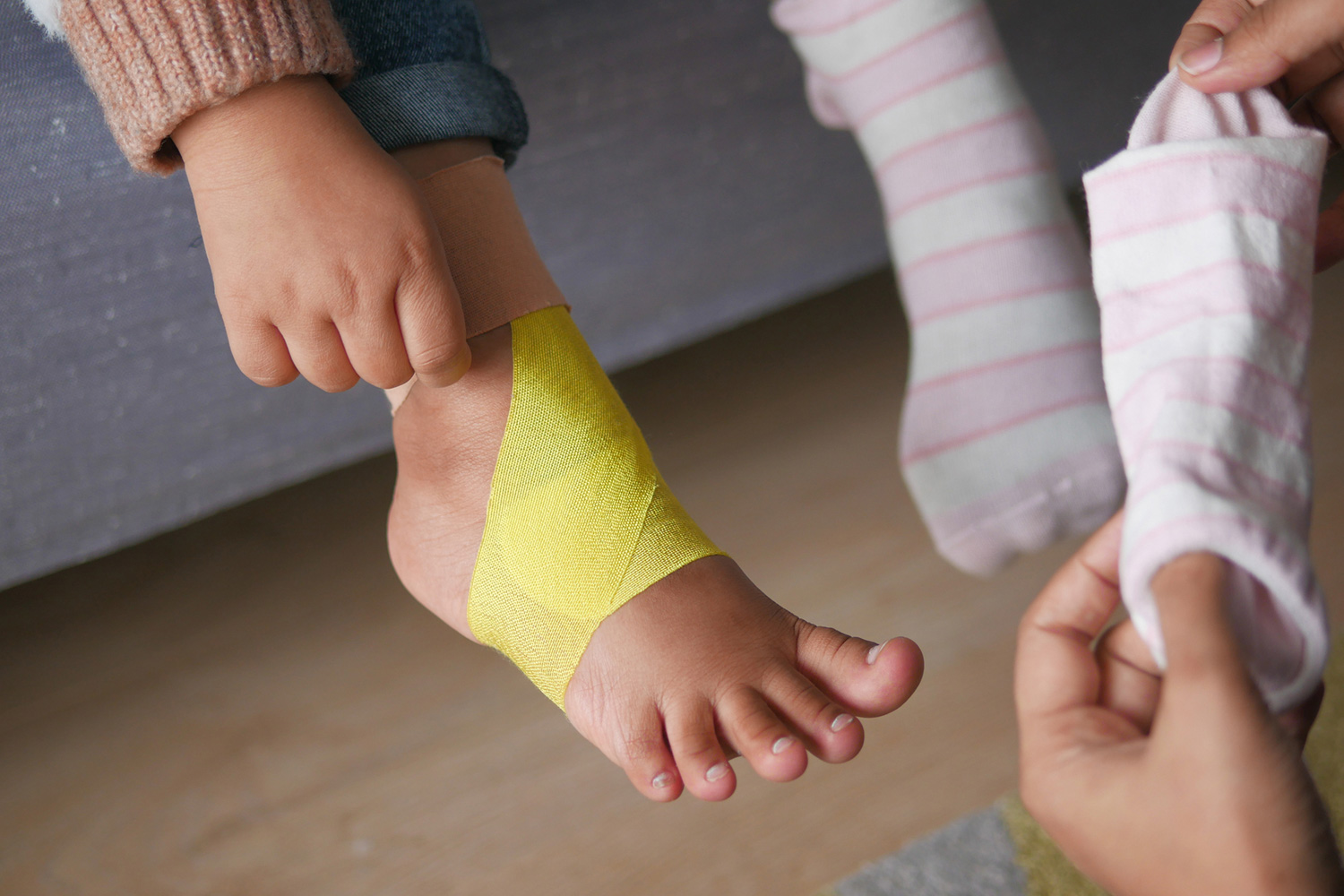 Child with wrapped injury on foot